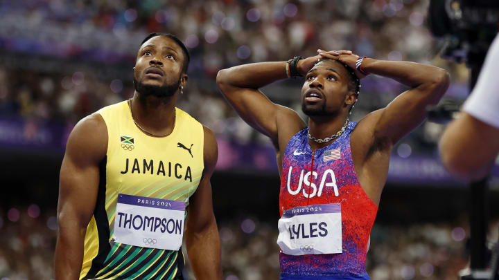 Aug 4, 2024; Paris Saint-Denis, France; Kishane Thompson (JAM) and Noah Lyles (USA) await the results of the men's 100m final during the Paris 2024 Olympic Summer Games at Stade de France. 