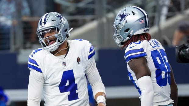 Dallas Cowboys QB Dak Prescott, left, and CeeDee Lamb celebrate a touchdown.