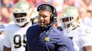 Sep 27, 2025; Fayetteville, Arkansas, USA; Notre Dame Fighting Irish head coach Marcus Freeman during the first quarter against the Arkansas Razorbacks at Donald W. Reynolds Razorback Stadium. 