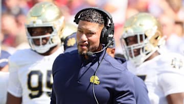Sep 27, 2025; Fayetteville, Arkansas, USA; Notre Dame Fighting Irish head coach Marcus Freeman during the first quarter against the Arkansas Razorbacks at Donald W. Reynolds Razorback Stadium. 