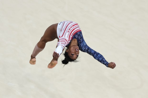 U.S. gymnast Simone Biles flips during her floor routine at the Paris Olympics. 