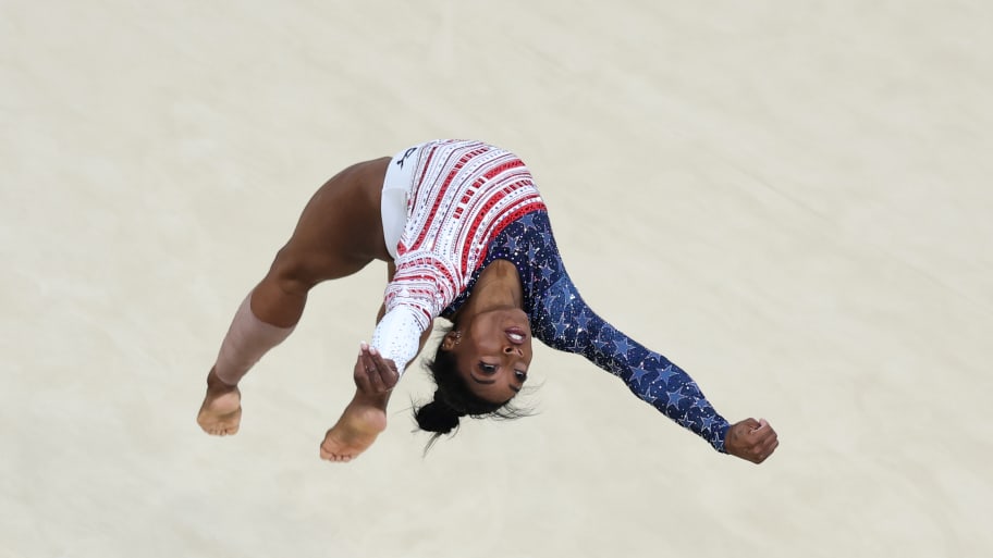 U.S. gymnast Simone Biles flips during her floor routine at the Paris Olympics. 