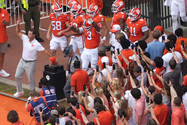 Clemson head coach Dabo Swinney rubs Howard’s Rock. 