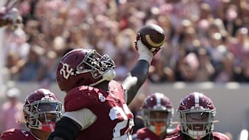 Oct 12, 2024; Tuscaloosa, Alabama, USA;  Alabama Crimson Tide defensive lineman LT Overton (22) celebrates after recovering a South Carolina fumble at Bryant-Denny Stadium. Alabama defeated South Carolina 27-25. Mandatory Credit: Gary Cosby Jr.-Imagn Images