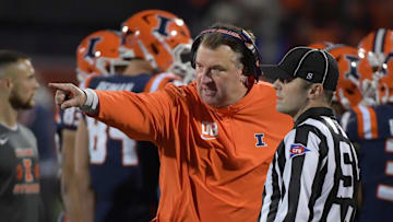 Oct 6, 2023; Champaign, Illinois, USA; Illinois Fighting Illini head coach Bret Bielema talks with an official during the first half against the Nebraska Cornhuskers at Memorial Stadium. Mandatory Credit: Ron Johnson-Imagn Images