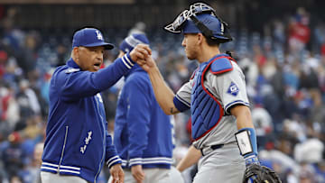 Apr 25, 2024; Washington, District of Columbia, USA; Los Angeles Dodgers manager Dave Roberts (30) celebrates with Dodgers catcher Austin Barnes (15) after their game against the Washington Nationals at Nationals Park. Mandatory Credit: Geoff Burke-Imagn Images