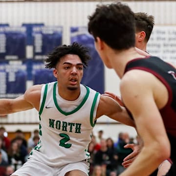 Oshkosh North High School's Xzavion Mitchell (2) drives to the basket against De Pere High School during a WIAA Division 1 section final on Saturday, March 15, 2025, at Appleton North High School in Appleton, Wis. Oshkosh North upset the top-seeded Redbirds, 79-75, to advance to the WIAA state boys basketball tournament.
