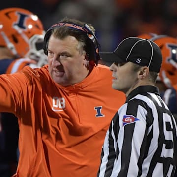 Oct 6, 2023; Champaign, Illinois, USA; Illinois Fighting Illini head coach Bret Bielema talks with an official during the first half against the Nebraska Cornhuskers at Memorial Stadium. Mandatory Credit: Ron Johnson-Imagn Images