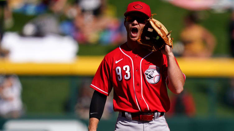 Cincinnati Reds infielder Matt McLain (93) instructs teammates during a spring training game.