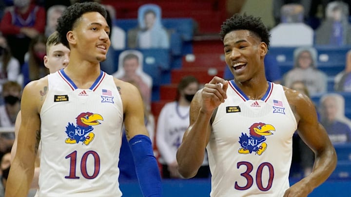 Dec 11, 2020; Lawrence, Kansas, USA; Kansas Jayhawks forward Jalen Wilson (10) laughs with guard Ochai Agbaji (30) in a timeout during the first half against the Nebraska-Omaha Mavericks at Allen Fieldhouse. Mandatory Credit: Denny Medley-Imagn Images