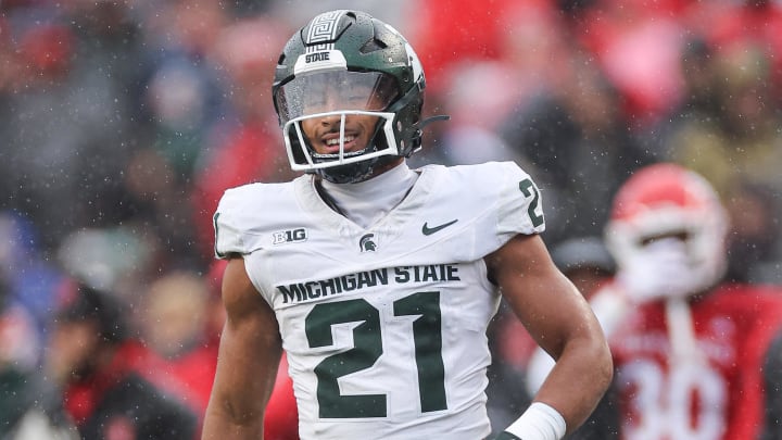 Oct 14, 2023; Piscataway, New Jersey, USA; Michigan State Spartans defensive back Dillon Tatum (21) reacts after a defensive stop against the Rutgers Scarlet Knights  during the first half at SHI Stadium. Mandatory Credit: Vincent Carchietta-USA TODAY Sports