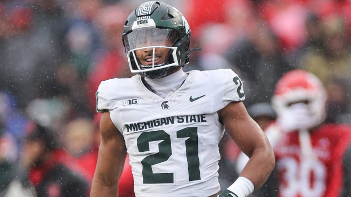 Oct 14, 2023; Piscataway, New Jersey, USA; Michigan State Spartans defensive back Dillon Tatum (21) reacts after a defensive stop against the Rutgers Scarlet Knights  during the first half at SHI Stadium. Mandatory Credit: Vincent Carchietta-USA TODAY Sports