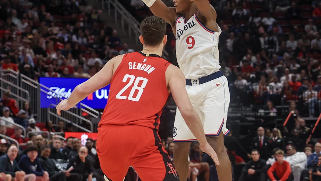 Feb 11, 2026; Houston, Texas, USA;  Los Angeles Clippers guard Bennedict Mathurin (9) passes against Houston Rockets center Alperen Sengun (28)in the second quarter at Toyota Center. Mandatory Credit: Thomas Shea-Imagn Images