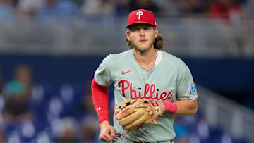 Jun 19, 2025; Miami, Florida, USA; Philadelphia Phillies third baseman Alec Bohm (28) returns to the dugout against the Miami Marlins after the seventh inning at loanDepot Park.