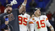Jan 28, 2024; Baltimore, Maryland, USA; Kansas City Chiefs tight end Travis Kelce (M) celebrates with the Lamar Hunt trophy next to Chiefs defensive tackle Chris Jones (95) and Chiefs quarterback Patrick Mahomes (15) while speaking with CBS broadcaster Jim Nantz (L) after the Chiefs' game against the Baltimore Ravens in the AFC Championship football game at M&T Bank Stadium. Mandatory Credit: Geoff Burke-USA TODAY Sports