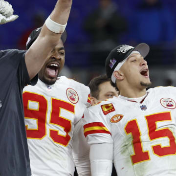 Jan 28, 2024; Baltimore, Maryland, USA; Kansas City Chiefs tight end Travis Kelce (M) celebrates with the Lamar Hunt trophy next to Chiefs defensive tackle Chris Jones (95) and Chiefs quarterback Patrick Mahomes (15) while speaking with CBS broadcaster Jim Nantz (L) after the Chiefs' game against the Baltimore Ravens in the AFC Championship football game at M&T Bank Stadium. Mandatory Credit: Geoff Burke-USA TODAY Sports