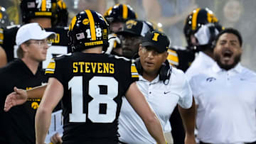 Iowa Hawkeyes special teams coordinator LeVar Woods high-fives place kicker Drew Stevens (18) during a game against the Albany Great Danes Aug. 30, 2025 at Kinnick Stadium in Iowa City, Iowa.