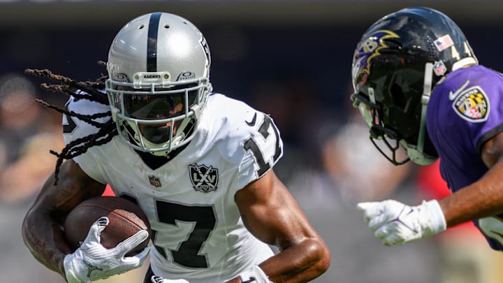 Sep 15, 2024; Baltimore, Maryland, USA; Las Vegas Raiders wide receiver Davante Adams (17) runs with the ball as Baltimore Ravens cornerback Marlon Humphrey (44) defends during the second half at M&T Bank Stadium. Mandatory Credit: Reggie Hildred-Imagn Images