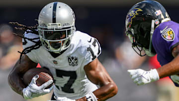 Sep 15, 2024; Baltimore, Maryland, USA; Las Vegas Raiders wide receiver Davante Adams (17) runs with the ball as Baltimore Ravens cornerback Marlon Humphrey (44) defends during the second half at M&T Bank Stadium. Mandatory Credit: Reggie Hildred-Imagn Images
