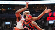 Toronto Raptors forward Brandon Ingram dribbles against New York Knicks center Mitchell Robinson.