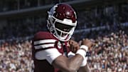 Mississippi State Bulldogs quarterback Kamario Taylor (1) celebrates after scoring a touchdown against the Mississippi Rebels in the first half at Davis Wade Stadium at Scott Field.
