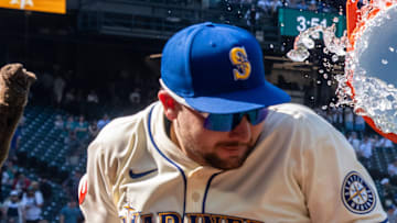 Seattle Mariners centerfielder Julio Rodriguez (44), right, attempts to douse catcher Cal Raleigh (29) with water after a game against the Athletics at T-Mobile Park on Aug. 24.