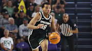Nov 25, 2025; Fort Myers, Florida, USA; Michigan State Spartans guard Divine Ugochukwu (99) controls the ball against the East Carolina Pirates in the second half at Suncoast Credit Union Arena. Mandatory Credit: Nathan Ray Seebeck-Imagn Images