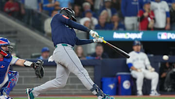 Oct 20, 2025; Toronto, Ontario, CAN; Seattle Mariners second baseman Jorge Polanco (7) singles in the third inning against the Toronto Blue Jays during game seven of the ALCS round for the 2025 MLB playoffs at Rogers Centre. Mandatory Credit: Nick Turchiaro-Imagn Images