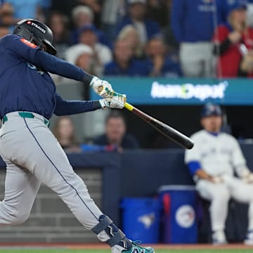 Oct 20, 2025; Toronto, Ontario, CAN; Seattle Mariners second baseman Jorge Polanco (7) singles in the third inning against the Toronto Blue Jays during game seven of the ALCS round for the 2025 MLB playoffs at Rogers Centre. Mandatory Credit: Nick Turchiaro-Imagn Images