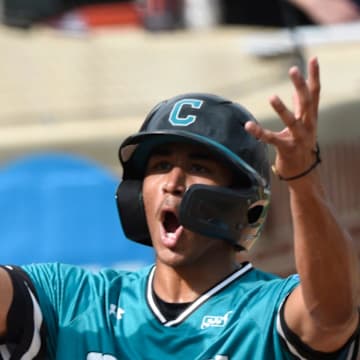 Coastal Carolina Chanticleer's Sebastian Alexander (1) scores late against Auburn during game two of the NCAA Baseball Super Regonal at Plainsman Park in Auburn, Ala., on Friday June 6, 2025.