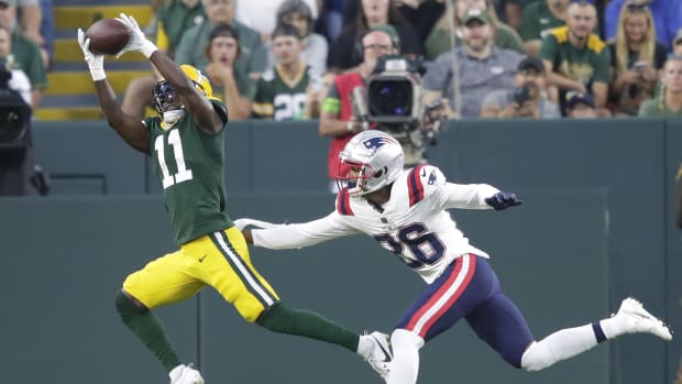 Green Bay Packers wide receiver Jayden Reed (11) pulls down a touchdown reception against Shawn Wade (26).