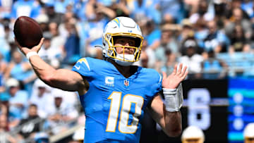 Sep 15, 2024; Charlotte, North Carolina, USA;  Los Angeles Chargers quarterback Justin Herbert (10) looks to pass in the second quarter at Bank of America Stadium. Mandatory Credit: Bob Donnan-Imagn Images