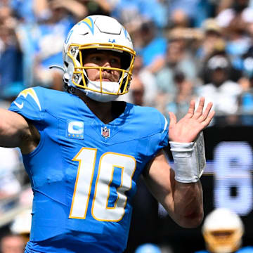 Sep 15, 2024; Charlotte, North Carolina, USA;  Los Angeles Chargers quarterback Justin Herbert (10) looks to pass in the second quarter at Bank of America Stadium. Mandatory Credit: Bob Donnan-Imagn Images