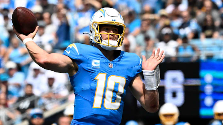 Sep 15, 2024; Charlotte, North Carolina, USA;  Los Angeles Chargers quarterback Justin Herbert (10) looks to pass in the second quarter at Bank of America Stadium. Mandatory Credit: Bob Donnan-Imagn Images