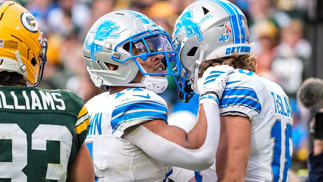 Detroit Lions wide receiver Isaac TeSlaa (18) celebrates his touchdown against the Green Bay Packers with wide receiver Amon-Ra St. Brown (14) during the second half at Lambeau Field in Green Bay, Wisconsin, on Sunday, September 7, 2025.