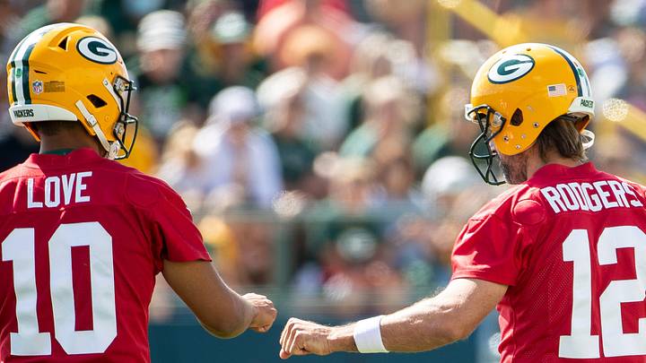 Green Bay Packers quarterback Jordan Love (10) and quarterback Aaron Rodgers (12).