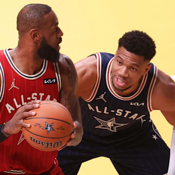 Eastern Conference forward Giannis Antetokounmpo of the Milwaukee Bucks defends Western Conference forward LeBron James of the Los Angeles Lakers during the first quarter in the 73rd NBA All Star game at Gainbridge Fieldhouse. Mandatory Credit: Trevor Ruszkowski-Imagn Images