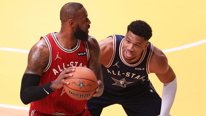 Eastern Conference forward Giannis Antetokounmpo of the Milwaukee Bucks defends Western Conference forward LeBron James of the Los Angeles Lakers during the first quarter in the 73rd NBA All Star game at Gainbridge Fieldhouse. Mandatory Credit: Trevor Ruszkowski-Imagn Images