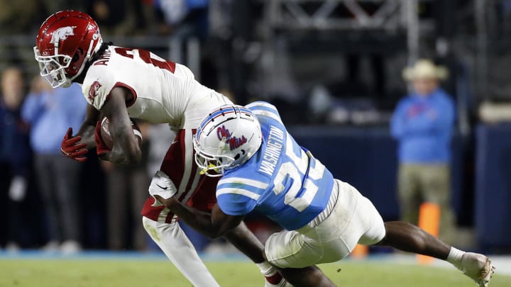 Oct 7, 2023; Oxford, Mississippi, USA; Arkansas Razorbacks wide receiver Andrew Armstrong (2) runs after a catch as Mississippi Rebels defensive back Trey Washington (25) makes the tackle during the second half  at Vaught-Hemingway Stadium. Mandatory Credit: Petre Thomas-USA TODAY Sports