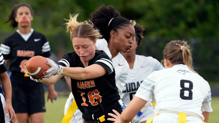 Spruce Creek quarterback Jillian Truax (16) reaches for extra yardage during a flag football game with New Smyrna last year. Last week, she helped lead the Hawks past Tocoi Creek, 7-6, in a Class 4A regional quarterfinal game,
