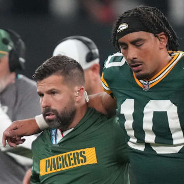 Green Bay Packers quarterback Jordan Love (10) is assisted off the field after an injury during the fourth quarter in Brazil.