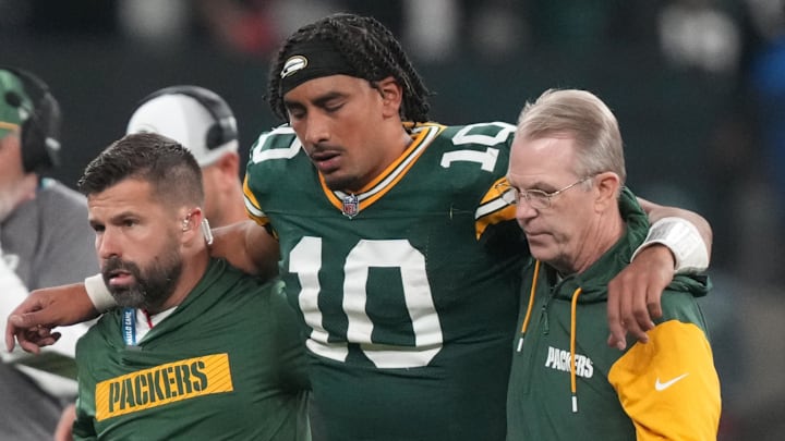 Green Bay Packers quarterback Jordan Love (10) is assisted off the field after an injury during the fourth quarter in Brazil.