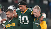 Sep 6, 2024; Sao Paulo, BRA; Green Bay Packers quarterback Jordan Love (10) is assisted off the field after an injury during the second half against the Philadelphia Eagles at Neo Quimica Arena. Mandatory Credit: Kirby Lee-Imagn Images