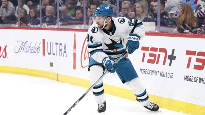 Feb 14, 2024; Winnipeg, Manitoba, CAN; San Jose Sharks Alexander Barabanov (94) skates with the puck in the second period against the Winnipeg Jets at Canada Life Centre. Mandatory Credit: James Carey Lauder-USA TODAY Sports