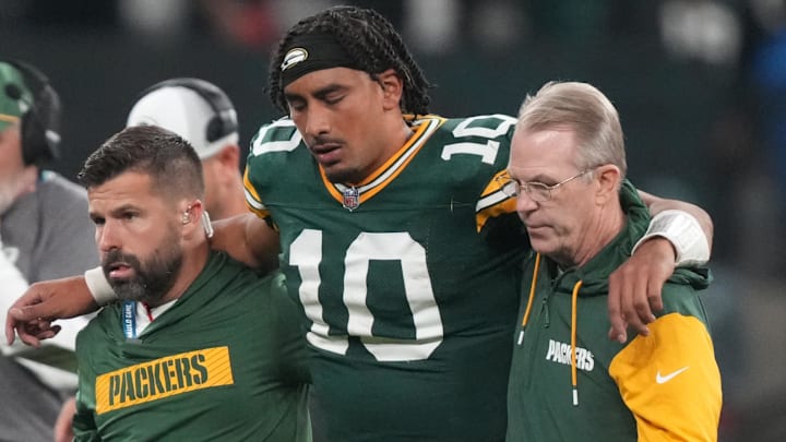 Sep 6, 2024; Sao Paulo, BRA; Green Bay Packers quarterback Jordan Love (10) is assisted off the field after an injury during the second half against the Philadelphia Eagles at Neo Quimica Arena. Mandatory Credit: Kirby Lee-Imagn Images