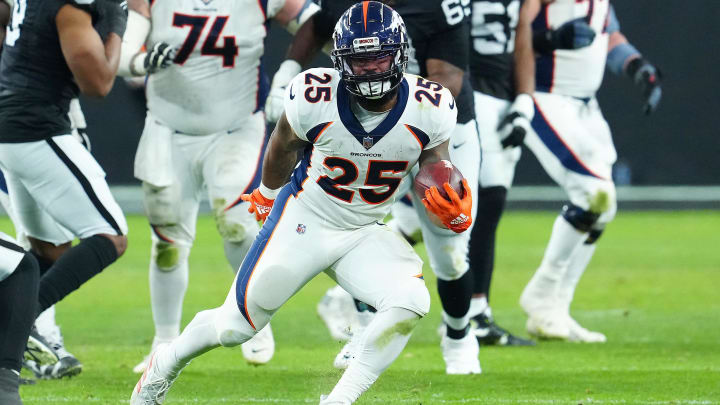 Jan 7, 2024; Paradise, Nevada, USA; Denver Broncos running back Samaje Perine (25) gains yardage against the Las Vegas Raiders during the fourth quarter at Allegiant Stadium. Mandatory Credit: Stephen R. Sylvanie-USA TODAY Sports