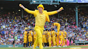 Team owner Jesse Cole runs toward the stands with shirts during the Savannah Bananas first Banana Ball game at Fenway Park on Saturday, June 8, 2024.