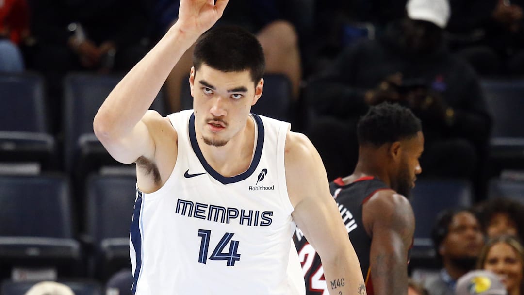Oct 18, 2024; Memphis, Tennessee, USA; Memphis Grizzlies center Zach Edey (14) react after a dunk during the first half against the Miami Heat at FedExForum. Mandatory Credit: Petre Thomas-Imagn Images

