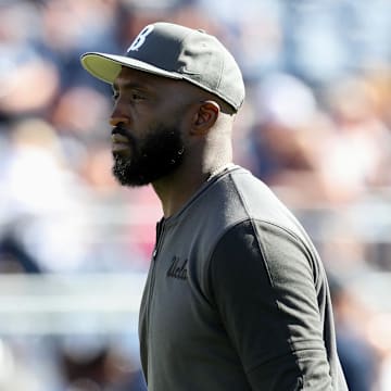Oct 5, 2024; University Park, Pennsylvania, USA; UCLA Bruins head coach DeShaun Foster walks on the field during a warmup prior to the game against the Penn State Nittany Lions at Beaver Stadium. Mandatory Credit: Matthew O'Haren-Imagn Images