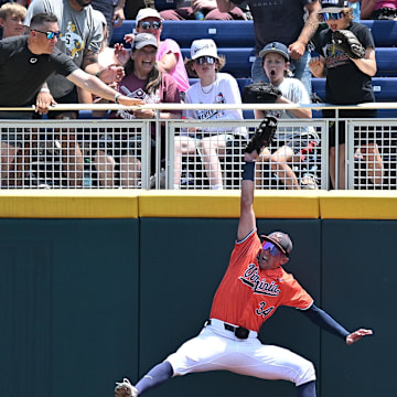 Jun 16, 2024; Omaha, NE, USA;  Fans react to a catch by Virginia Cavaliers center fielder Harrison Didawick (34) against the Florida State Seminoles during the second inning at Charles Schwab Field Omaha. Mandatory Credit: Steven Branscombe-Imagn Images